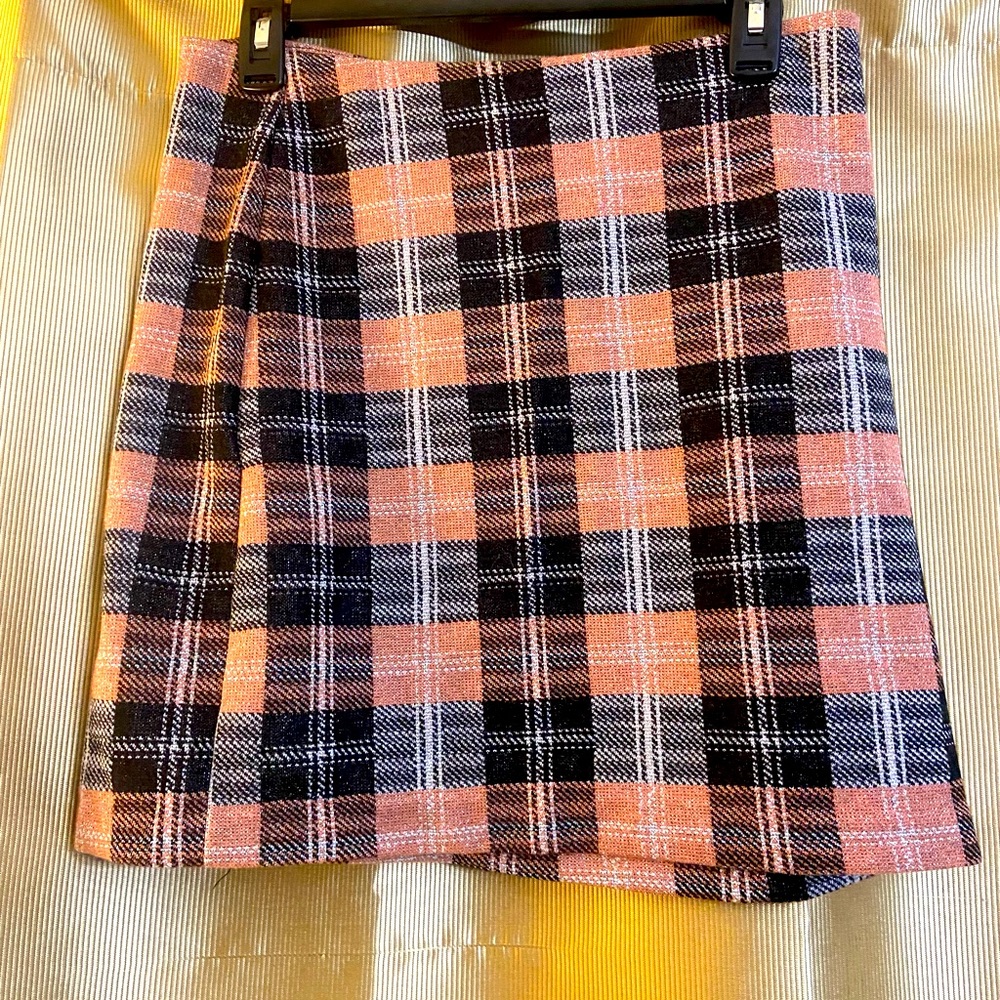 No Buttons or Zipper, just pull up an place skirt to your liking. Polyester.